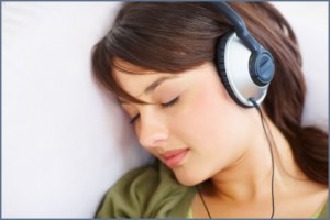 Young female fallen asleep while listening to music