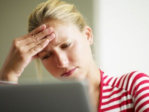 Woman looking at laptop