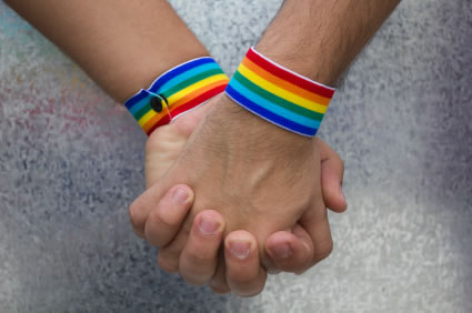 two hands together celebrating Gay Pride
