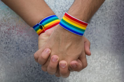 two hands together celebrating Gay Pride 