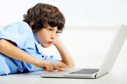 boy using  laptop