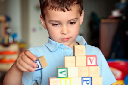 Autistic boy with building blocks