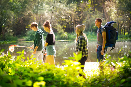 hiking teenagers at the lake